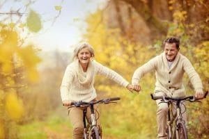 senior couple biking